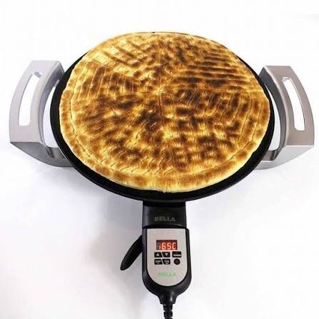 Grmawit Bella Mogogo electric injera maker with a 46 cm non-stick surface cooking a large flatbread
